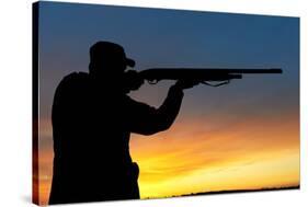 Hunter Aiming the Hunting Rifle during a Hunt at Sunrise-kadmy-Stretched Canvas