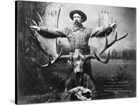 Hunter with Record Moose Antlers-null-Stretched Canvas