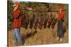 Hunters Carrying Giant Grasshoppers-null-Stretched Canvas