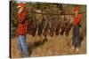 Hunters Carrying Giant Grasshoppers-null-Stretched Canvas