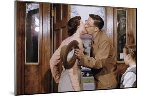 Husband and Wife Kissing Goodbye-William P. Gottlieb-Mounted Photographic Print