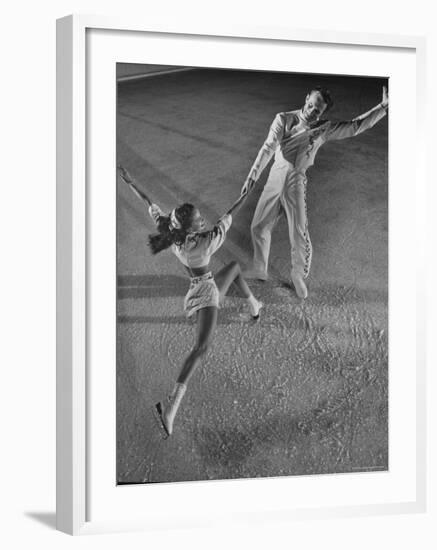 Husband and Wife Skating Team Narena Greer and Richard Norris Skating with "The Ice Follies"-Gjon Mili-Framed Photographic Print