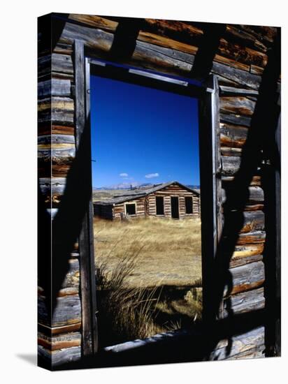 Hut Framed by Window of Burnt Log Cabin, Wind River Country, Lander, USA-Brent Winebrenner-Stretched Canvas