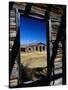 Hut Framed by Window of Burnt Log Cabin, Wind River Country, Lander, USA-Brent Winebrenner-Stretched Canvas