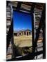 Hut Framed by Window of Burnt Log Cabin, Wind River Country, Lander, USA-Brent Winebrenner-Mounted Photographic Print