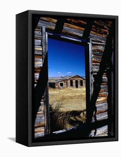 Hut Framed by Window of Burnt Log Cabin, Wind River Country, Lander, USA-Brent Winebrenner-Framed Stretched Canvas