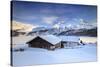 Huts and mountains covered in snow at sunset Spluga Maloja Canton of Graubunden Engadin Switzerland-ClickAlps-Stretched Canvas