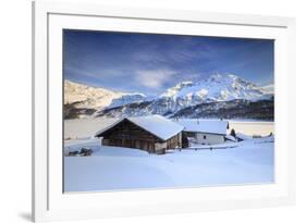 Huts and mountains covered in snow at sunset Spluga Maloja Canton of Graubunden Engadin Switzerland-ClickAlps-Framed Photographic Print