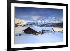 Huts and mountains covered in snow at sunset Spluga Maloja Canton of Graubunden Engadin Switzerland-ClickAlps-Framed Photographic Print