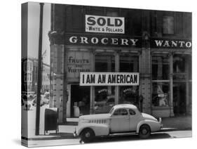 I Am an American Sign on a Store Front-null-Stretched Canvas