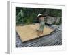 Iban Tribeswoman Raking Through Drying Rice Crop on Sacking Laid on Bamboo Longhouse Verandah-Annie Owen-Framed Photographic Print