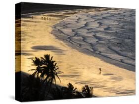 Icapui Beach, with People Fishing and Playing at Sunset-Alex Saberi-Stretched Canvas