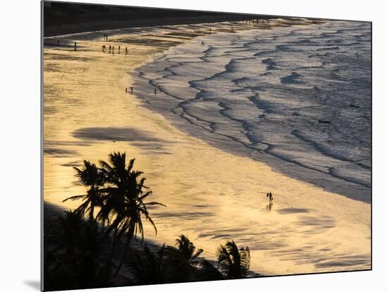 Icapui Beach, with People Fishing and Playing at Sunset-Alex Saberi-Mounted Photographic Print