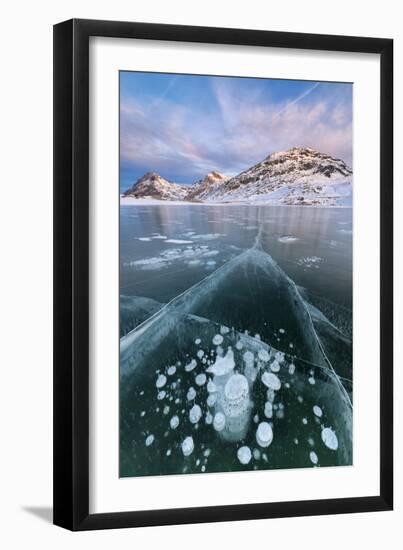 Ice bubbles frame the snowy peaks reflected in Lago Bianco, Bernina Pass, canton of Graubunden, Eng-Roberto Moiola-Framed Photographic Print