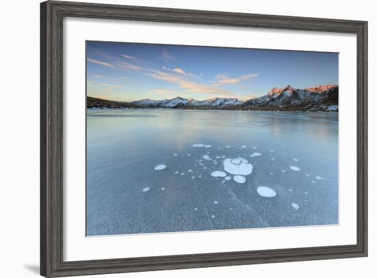 Ice Bubbles on the Frozen Surface of Andossi Lake at Sunrise, Spluga Valley, Valtellina, Italy-Roberto Moiola-Framed Photographic Print