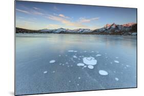Ice Bubbles on the Frozen Surface of Andossi Lake at Sunrise, Spluga Valley, Valtellina, Italy-Roberto Moiola-Mounted Photographic Print