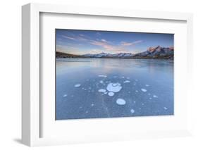Ice bubbles on the frozen surface of Andossi Lake at sunrise Spluga Valley Valtellina Lombardy Ital-ClickAlps-Framed Photographic Print