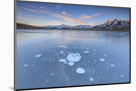 Ice bubbles on the frozen surface of Andossi Lake at sunrise Spluga Valley Valtellina Lombardy Ital-ClickAlps-Mounted Photographic Print