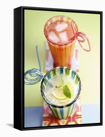 Ice-Cold Lemonade and Pink Grapefruit Juice in Glasses-null-Framed Stretched Canvas