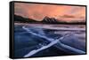 Ice cracks along Abraham Lake in Banff, Canada at sunset with pink clouds and scenic mountains-David Chang-Framed Stretched Canvas