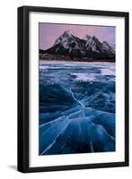 Ice cracks along Abraham Lake in Banff, Canada with purple clouds and scenic mountains-David Chang-Framed Premium Photographic Print