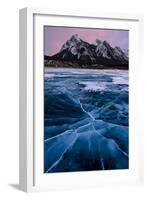 Ice cracks along Abraham Lake in Banff, Canada with purple clouds and scenic mountains-David Chang-Framed Photographic Print