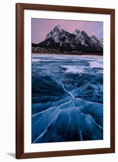 Ice cracks along Abraham Lake in Banff, Canada with purple clouds and scenic mountains-David Chang-Framed Photographic Print