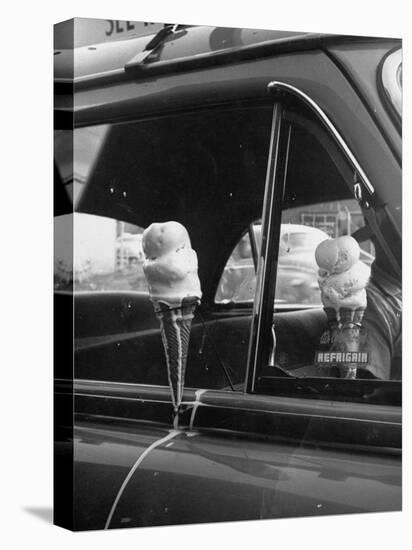 Ice Cream Cone Melting Outside Rolled Up Window of Air Conditioned Car-John Dominis-Stretched Canvas