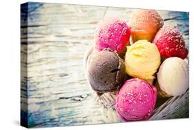 Ice Cream Scoops on Wooden Table, Close-Up.-Kesu01-Stretched Canvas