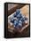 Ice Cubes with Blueberries on a Wooden Table-Chris Schäfer-Framed Stretched Canvas