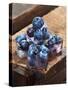 Ice Cubes with Blueberries on a Wooden Table-Chris Schäfer-Stretched Canvas