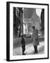 Ice Hockey Player Jean Beliveau, Standing in a Snow Covered Street Speaking to a Child-Yale Joel-Framed Premium Photographic Print