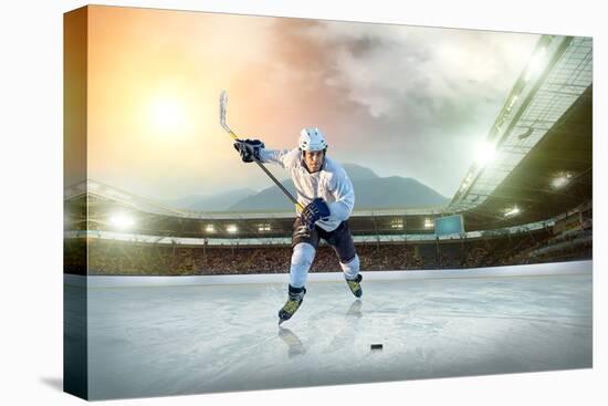 Ice Hockey Player on the Ice. Open Stadium - Winter Classic Game.-Andrey Yurlov-Stretched Canvas