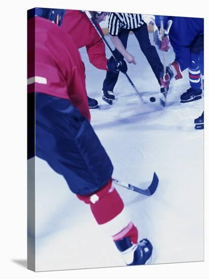 Ice Hockey Team Playing-null-Stretched Canvas