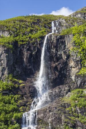 https://imgc.allpostersimages.com/img/posters/ice-melt-waterfall-on-the-olden-river-as-it-flows-along-briksdalen_u-L-PSY1710.jpg?artPerspective=n