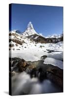 Ice on rocks frames granitic snowy peak of Stetind mountain under starry sky, Tysfjord, Norway-Roberto Moiola-Stretched Canvas