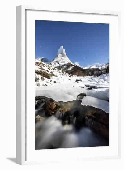 Ice on rocks frames granitic snowy peak of Stetind mountain under starry sky, Tysfjord, Norway-Roberto Moiola-Framed Photographic Print