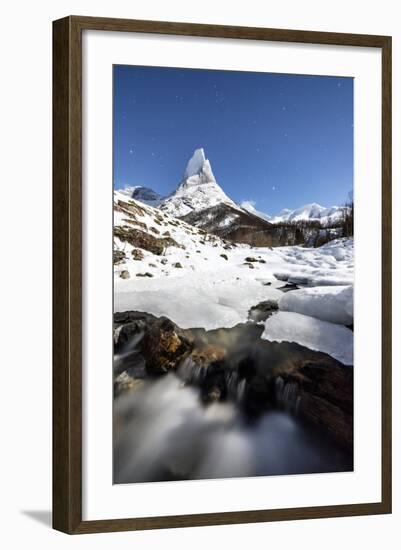 Ice on rocks frames granitic snowy peak of Stetind mountain under starry sky, Tysfjord, Norway-Roberto Moiola-Framed Photographic Print