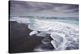 Ice on the seashore outside the Jokulsarlon lagoon, Jokulsarlon, Vatnajokull National Park-Nigel Hicks-Stretched Canvas