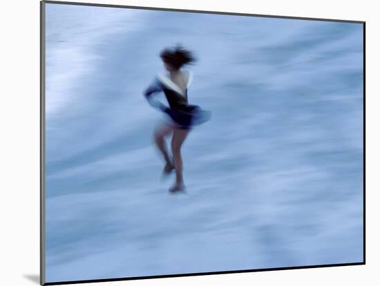Ice Skater in a Spin-null-Mounted Photographic Print