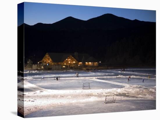 Ice Skating and Hockey on Evergreen Lake, Colorado, USA-Chuck Haney-Stretched Canvas