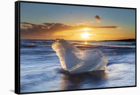 Iceberg from melting glacier on black sand beach near Jokulsarlon glacier lagoon-Ed Hasler-Framed Stretched Canvas