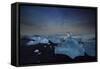 Iceberg on Black Sand Beach with Dramatic Sky-Alex Saberi-Framed Stretched Canvas