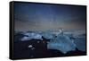Iceberg on Black Sand Beach with Dramatic Sky-Alex Saberi-Framed Stretched Canvas