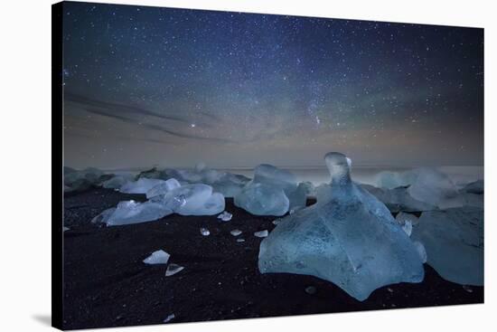 Iceberg on Black Sand Beach with Dramatic Sky-Alex Saberi-Stretched Canvas