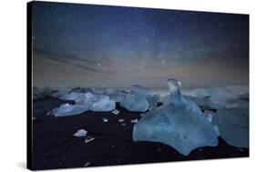 Iceberg on Black Sand Beach with Dramatic Sky-Alex Saberi-Stretched Canvas