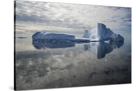 Iceberg reflected in still water of the Crystal Sound, Antarctic Peninsula, Antarctica-Michel Roggo-Stretched Canvas