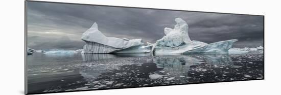 Icebergs floating in the Southern Ocean, Iceberg Graveyard, Lemaire Channel, Antarctic Peninsula...-Panoramic Images-Mounted Photographic Print