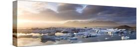 Icebergs Floating on the Jokulsarlon Glacial Lagoon at Sunset, Iceland, Polar Regions-Lee Frost-Stretched Canvas