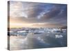 Icebergs Floating on the Jokulsarlon Glacial Lagoon at Sunset, Iceland, Polar Regions-Lee Frost-Stretched Canvas